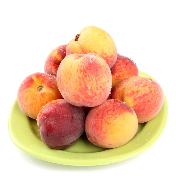 Fresh peaches on a plate — Stock Photo, Image