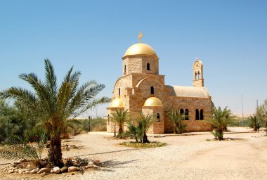 Modern Orthodox church at the Jordan River clipart