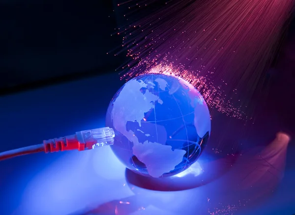 Technology earth globe against fiber optic background — Stock Photo, Image