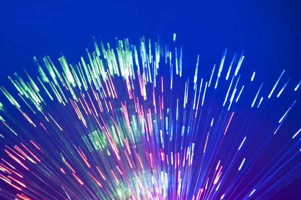 Fiber optics achtergrond met veel licht vlekken — Stockfoto