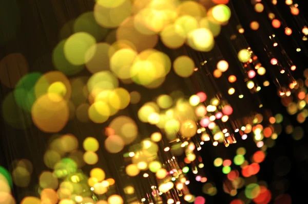 Fiberoptik bakgrund med massor av ljusa fläckar — Stockfoto