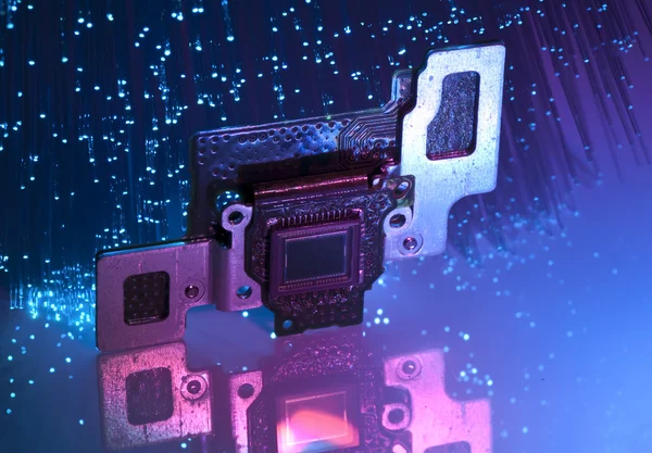 CCD sensor on a card of digital camera with fiber optical background — Stock Photo, Image
