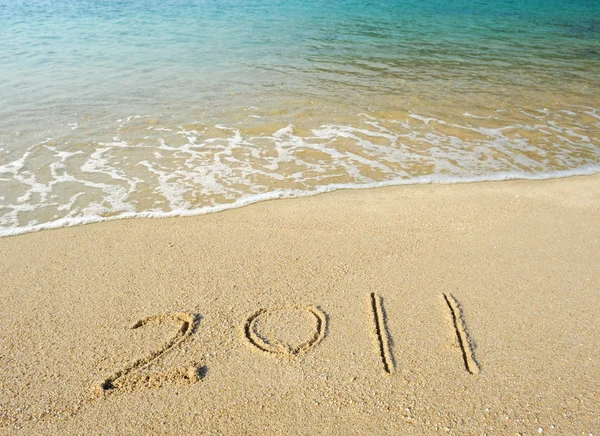 Nowy rok komunikat na piaszczystej plaży — Zdjęcie stockowe