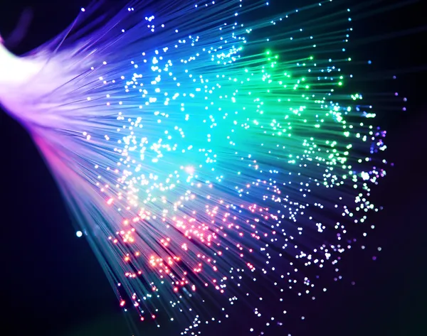 Bunch of optical fibres dinamic flying from deep on technology background — Stock Photo, Image