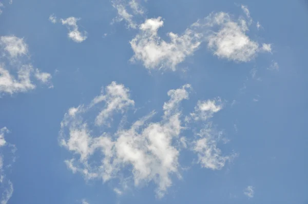 Blue sky with animal shaped clouds — Stock Photo, Image