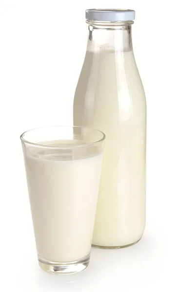 Bottiglia e un bicchiere di latte — Foto Stock