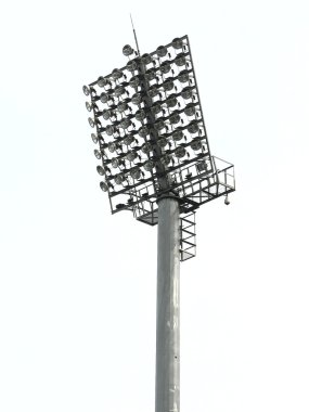 Big spotlights lighting tower at an stadium clipart