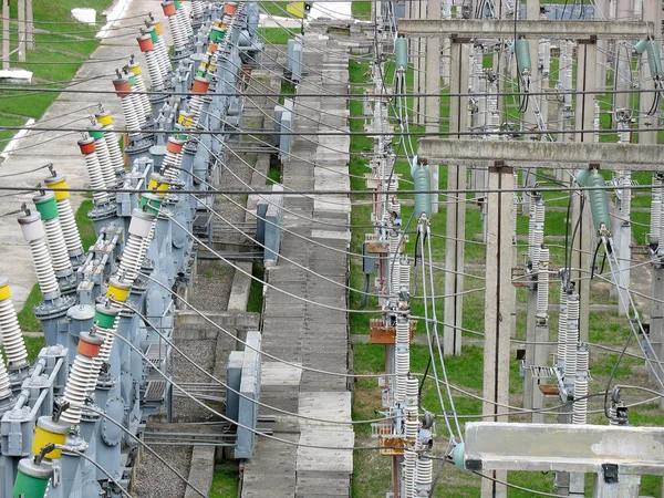 High voltage transmission power lines at power plant — Stock Photo, Image