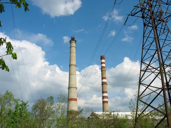 Two power plant chimneys against blue sky — Stock Photo, Image