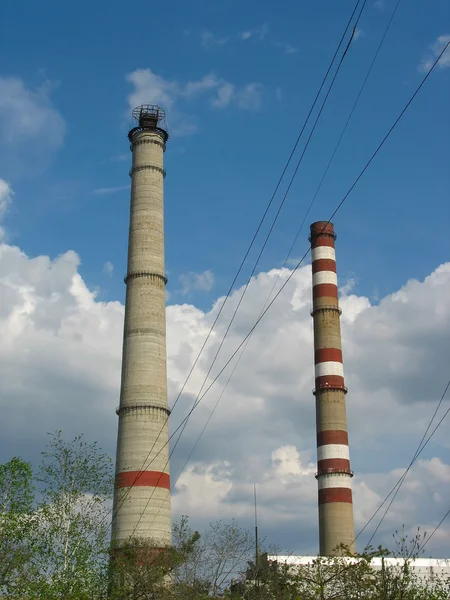 Two power plant chimneys against blue sky — Stock Photo, Image