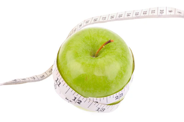 Green apple measured the meter — Stock Photo, Image