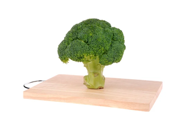Broccoli on cutting board isolated on white — Stock Photo, Image