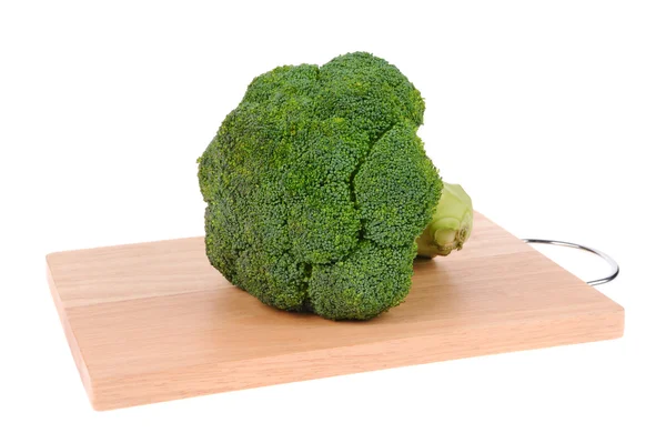 Broccoli on cutting board isolated on white — Stock Photo, Image