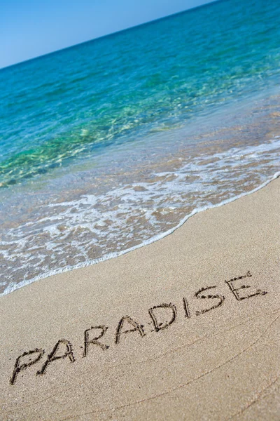 Paradise skriven på sanden — Stockfoto