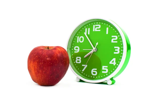 Uhr und ein Apfel — Stockfoto