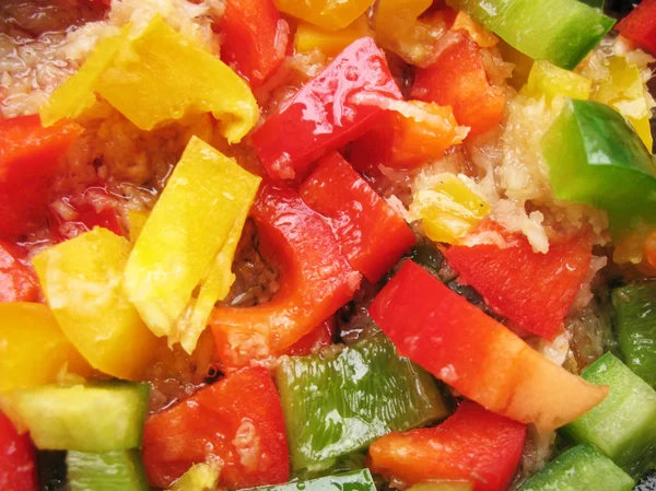 stock image Yellow, red and green Bulgarian pepper in skillet. Slicing. Cubes.