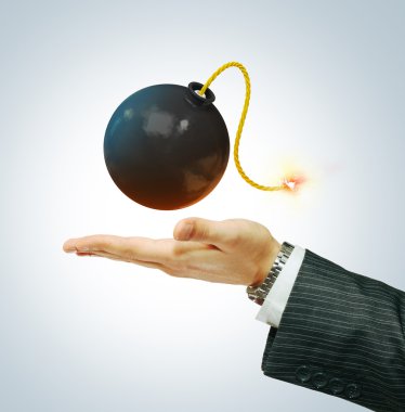 Bomb on businessman's hand clipart