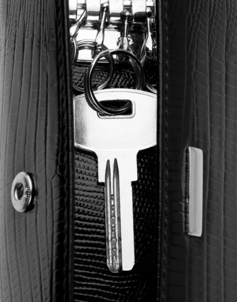 House key in leather holder — Stock Photo, Image