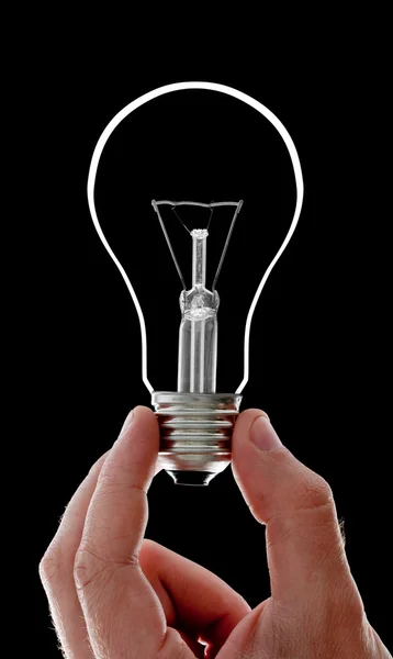 Электрическая лампочка в руке — стоковое фото