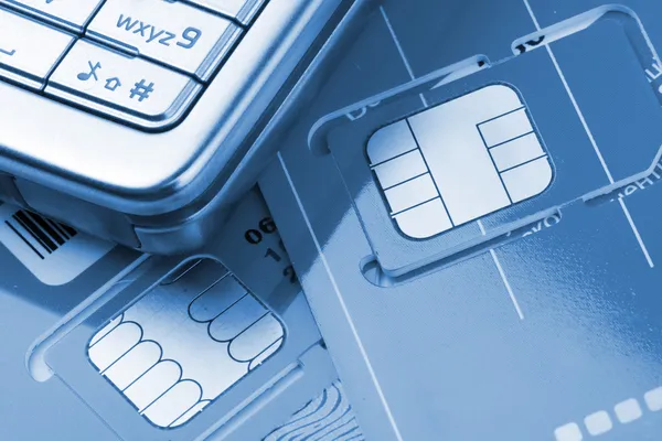 Telefone celular com cartões SIM — Fotografia de Stock