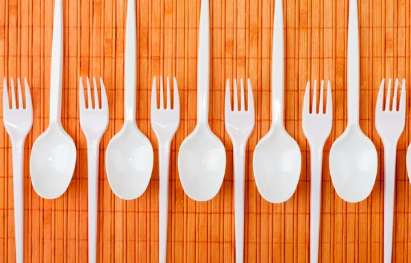 Plastic spoons and forks — Stock Photo, Image