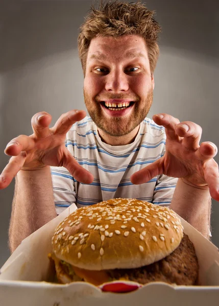 Happy man preparing to eat burger Stock Photo