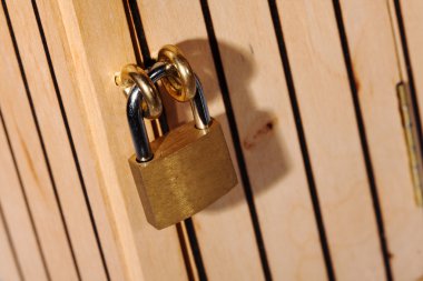 Padlock on wooden door clipart