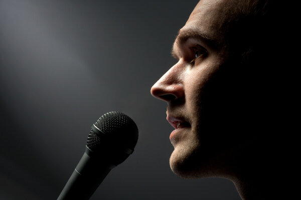 Man singing to microphone