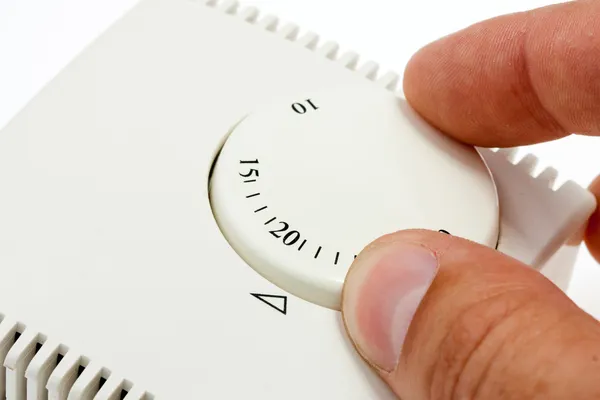 Hand setting room thermostat — Stock Photo, Image