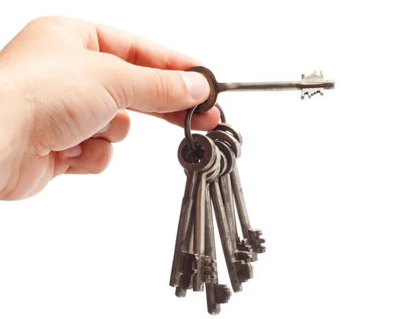 Gamla rostiga massa nycklar i hand — Stockfoto