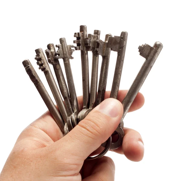 Oude rusty bunch van sleutels in de hand — Stockfoto
