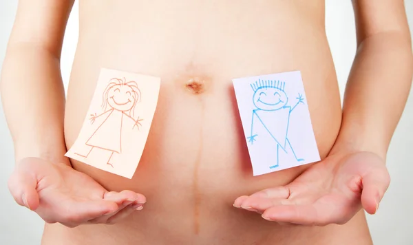 Paper stickers on pregnant woman abdomen — Stock Photo, Image