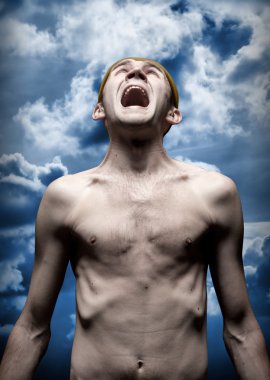 Despaired screaming man against dramatic sky clipart