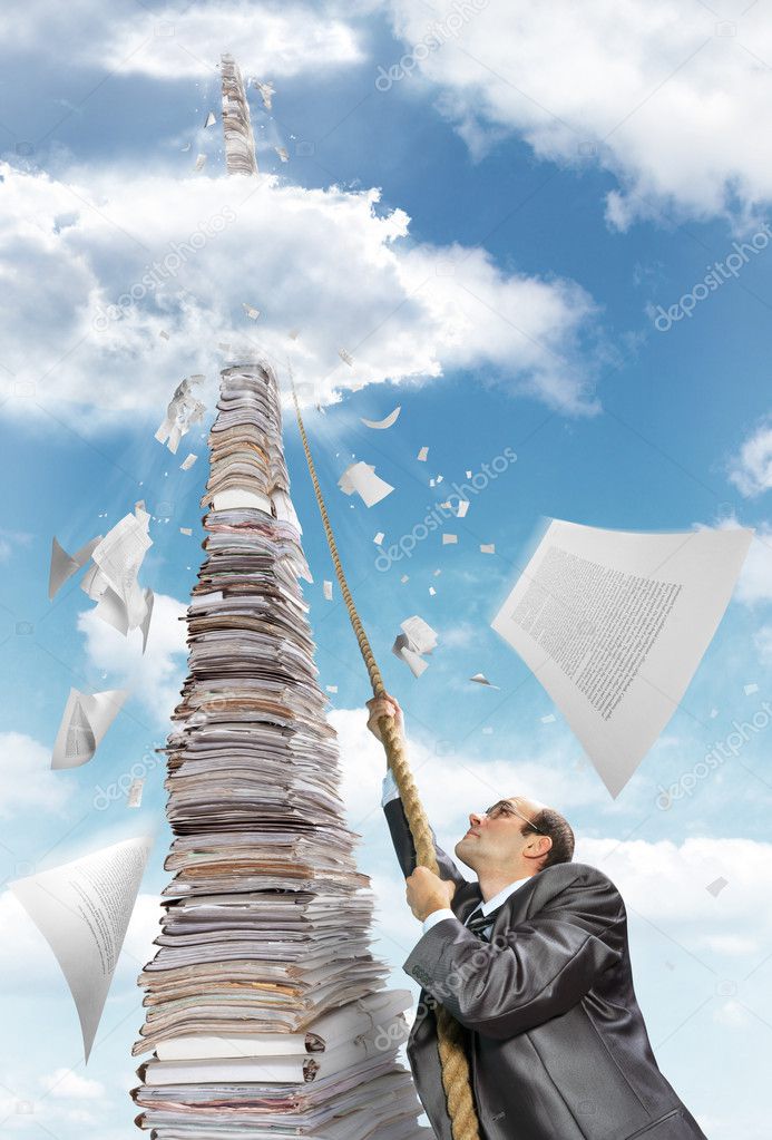 Businessman climbing up the pile of paperwork