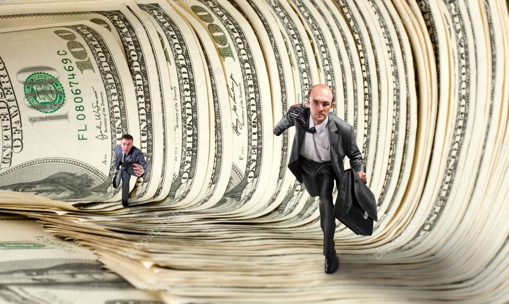 Businessmen running in dollar tunnel