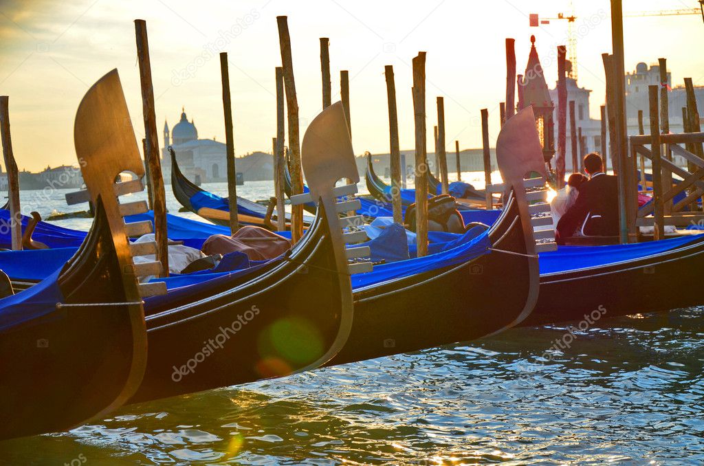 Row of gondolas on sunset, Venice
