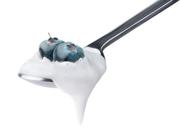 stock image Spoon of yogurt with blueberries on top