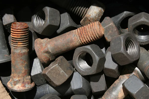 stock image Nuts and bolts in the form of background