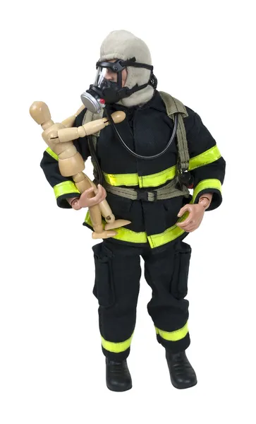 Brandman håller ett barn — Stockfoto
