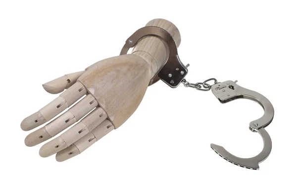 Handcuffs on a Wooden Hand — Stock Photo, Image