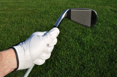 Golfer Holding an Iron (Golf Club) clipart