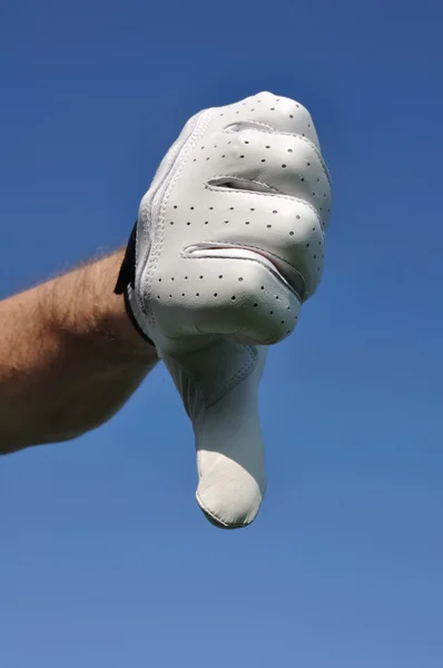 Golfspelare att ge tummen ner tecken — Stockfoto