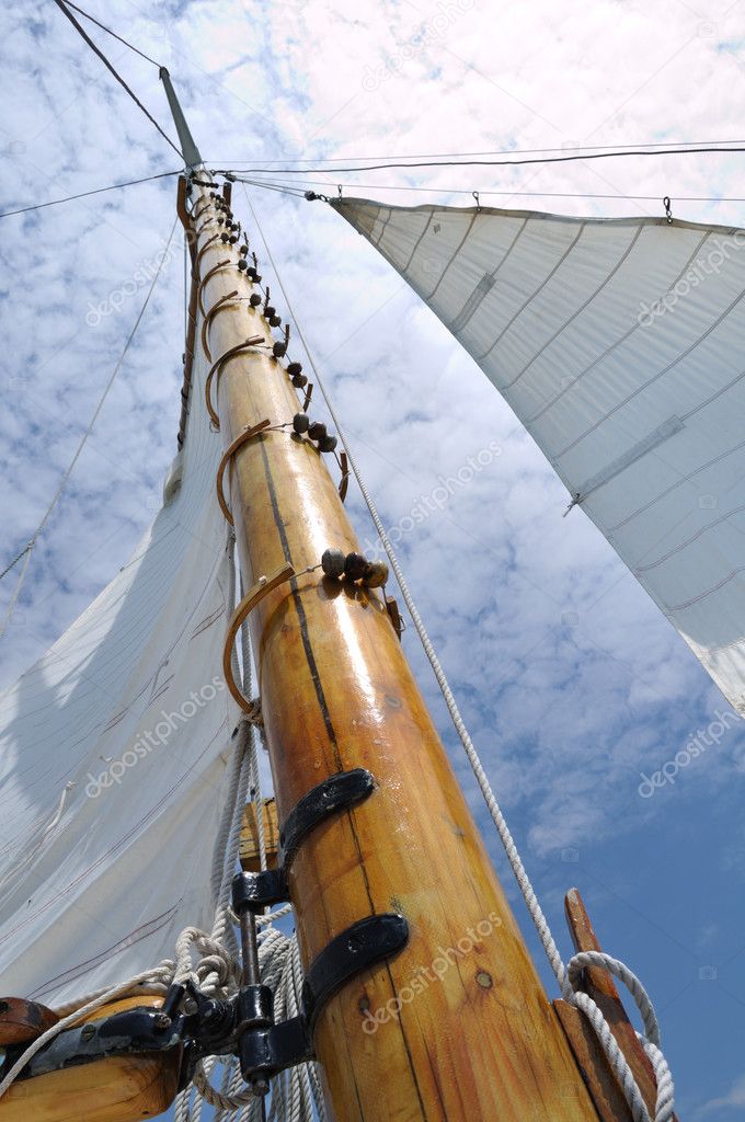 Foresail, Jib, and Wooden Mast of Schooner Sailboat