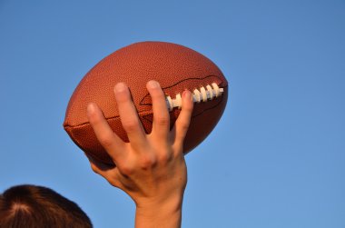 Quarterback Passing an American Football clipart