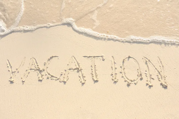Vacation Written in Sand on Beach — Stock Photo, Image
