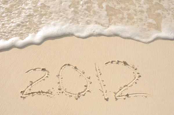 År 2012 skriven i sand på stranden — Stockfoto