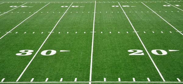 Двадцять і тридцяти дворі лінії на американський футбольне поле — стокове фото