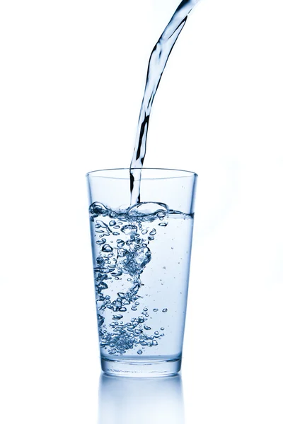 Water splash in glass Stock Image