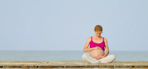 Pregnant woman on beach Royalty Free Stock Photos