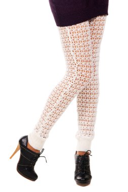 Woman's legs in a knitted leggings clipart